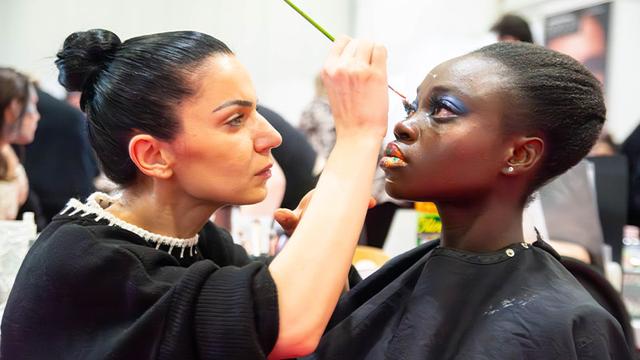 Ivanka Troncheva applies make-up to Balikis Akindiya at the Professional Beauty Makeup Competition 2024 in London.